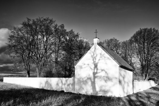 Lonely cemetery in the autumn field in Czech Republic