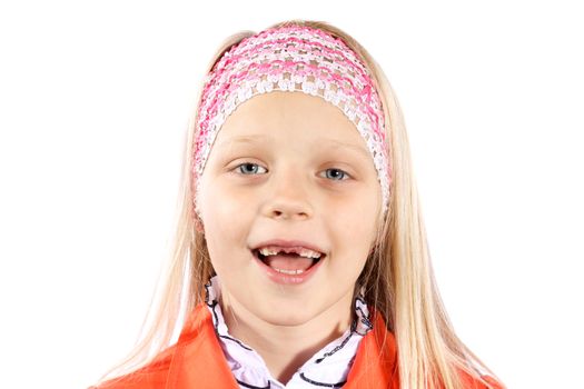 Portrait of smiling, cute, little girl with blond hair and missing front milk teeth.