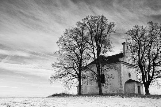 The ruins of small church on the hill in winter