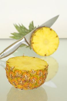 Beautiful ripe juicy pineapple sliced in half.