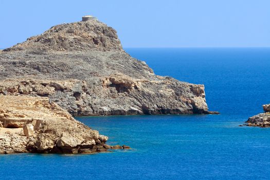 Mountains in the middle of the sea in Greece .