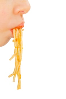 Face of little boy pulls spaghetti