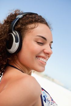 Young woman listening to music with a headset