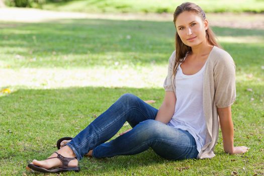 Young woman sitting on the lawn