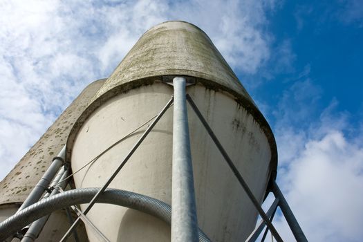 Agriculture farm grain silos in vertical angle facing the sky