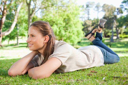 Young woman taking a moment off in the park