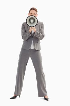 A businesswoman is holding a megaphone