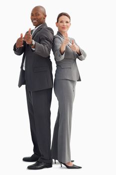 Business people who have their thumbs up