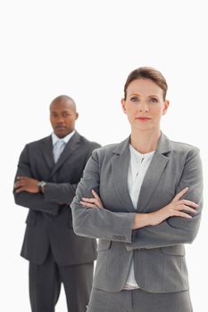 Serious businesswoman standing in front of businessman