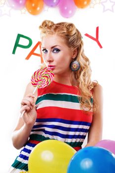 Pinup girl with lollipop, baloons and party word on white