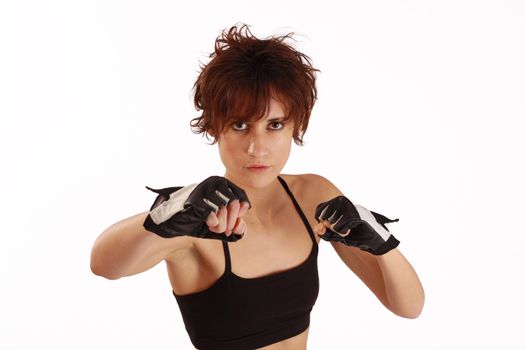 a young and fit female fighter posing in combat poses