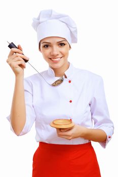 Young cook preparing food wearing a red apron