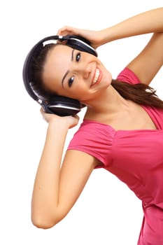 Happy smiling girl dancing and listening to music