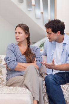 Portrait of a woman being mad at her boyfriend in their living room