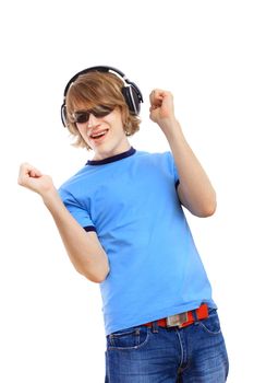 Happy smiling young man dancing and listening to music