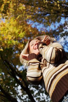 autumn woman hands in the air