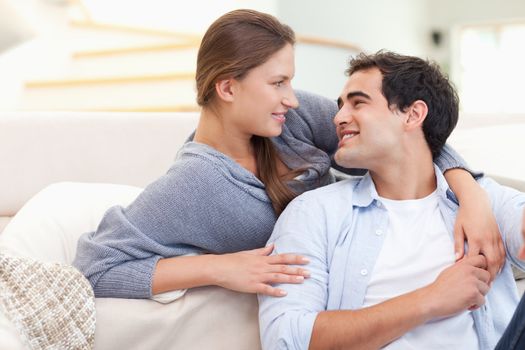 In love couple hugging in their living room