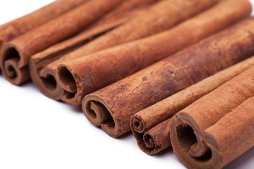 Cinnamon sticks spice over white background