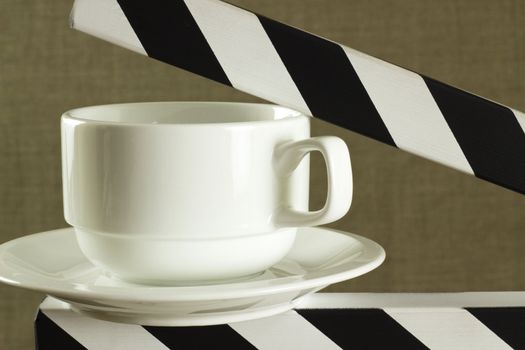 coffee break concept image with white cup on clapboard