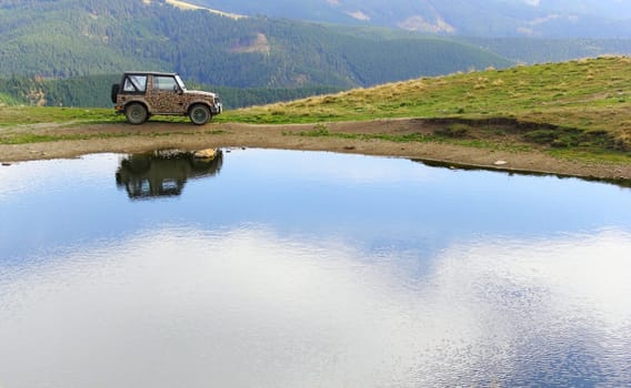 vehicle for extreme terrain near lake Icoana, Suhard mountains, Romania