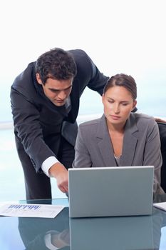 Portrait of a business team working with a notebook in an office