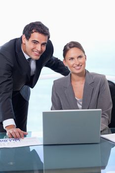 Portrait of a business team with a notebook in an office