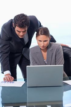 Portrait of a business team working with a laptop in an office