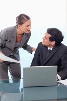 Portrait of a manager being unhappy with an employee in a meeting room