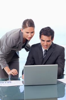 Portrait of a young business team working with a notebook in an office