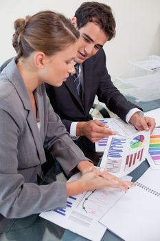 Portrait of a young business team studying statistics in a meeting room