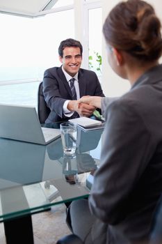 Portrait of a manager interviewing a female applicant in his office