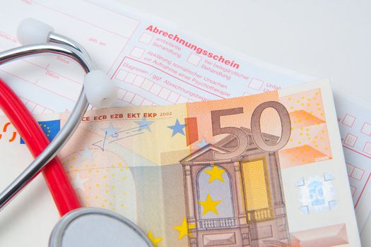 stethoscope and european currency on a german medical bill