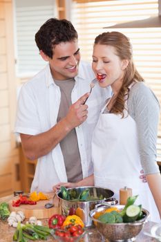 Young couple enjoys being in the kitchen together