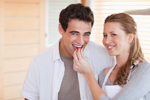 Happy young couple enjoys cooking together