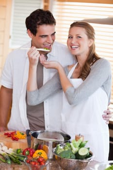 Young couple enjoys preparing dinner together
