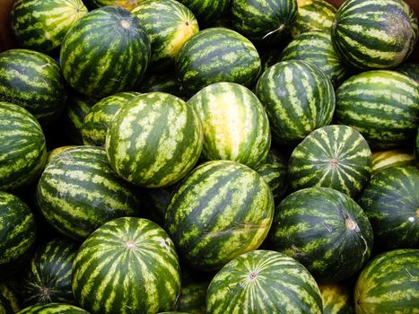 Green striped watermelon at produce stand in California