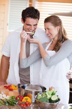 Young couple having fun cooking together