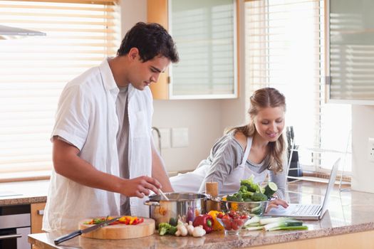 Young woman looking up recipe on the internet
