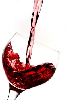 Glass with red wine on white background
