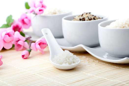 uncooked rice with porcelain bowls