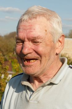 portrait of real old laughing man