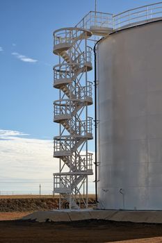 Silo staircase in the oil tank, vertical steel.