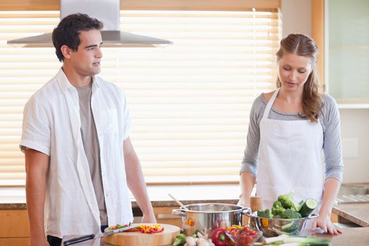 Young couple having a tensed situation in the kitchen