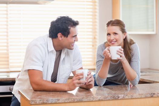 Young couple taking a coffee break together