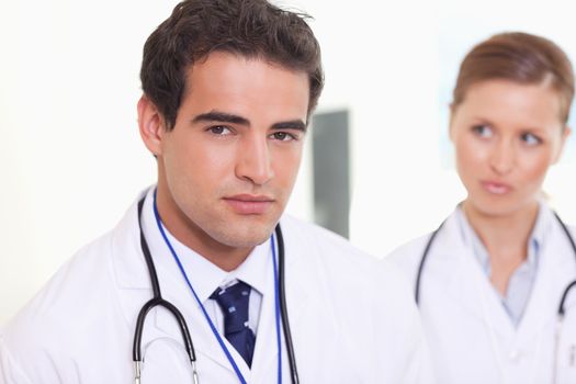 Young assistant doctors standing next to each other