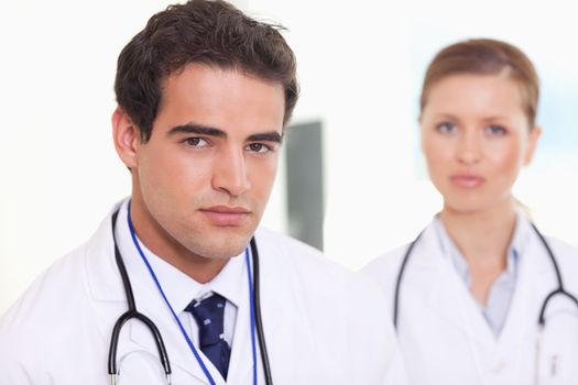Young medical assistants standing next to each other