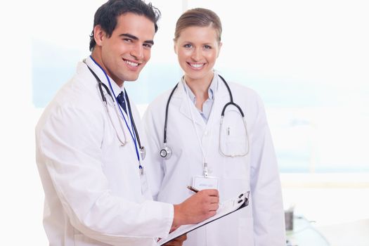 Young medical team taking notes