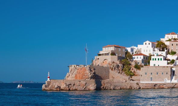 The historic entrance to the port of Hydra island, Greece