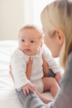 Young mother holding her newborn