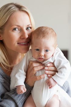 Young mother holding her baby